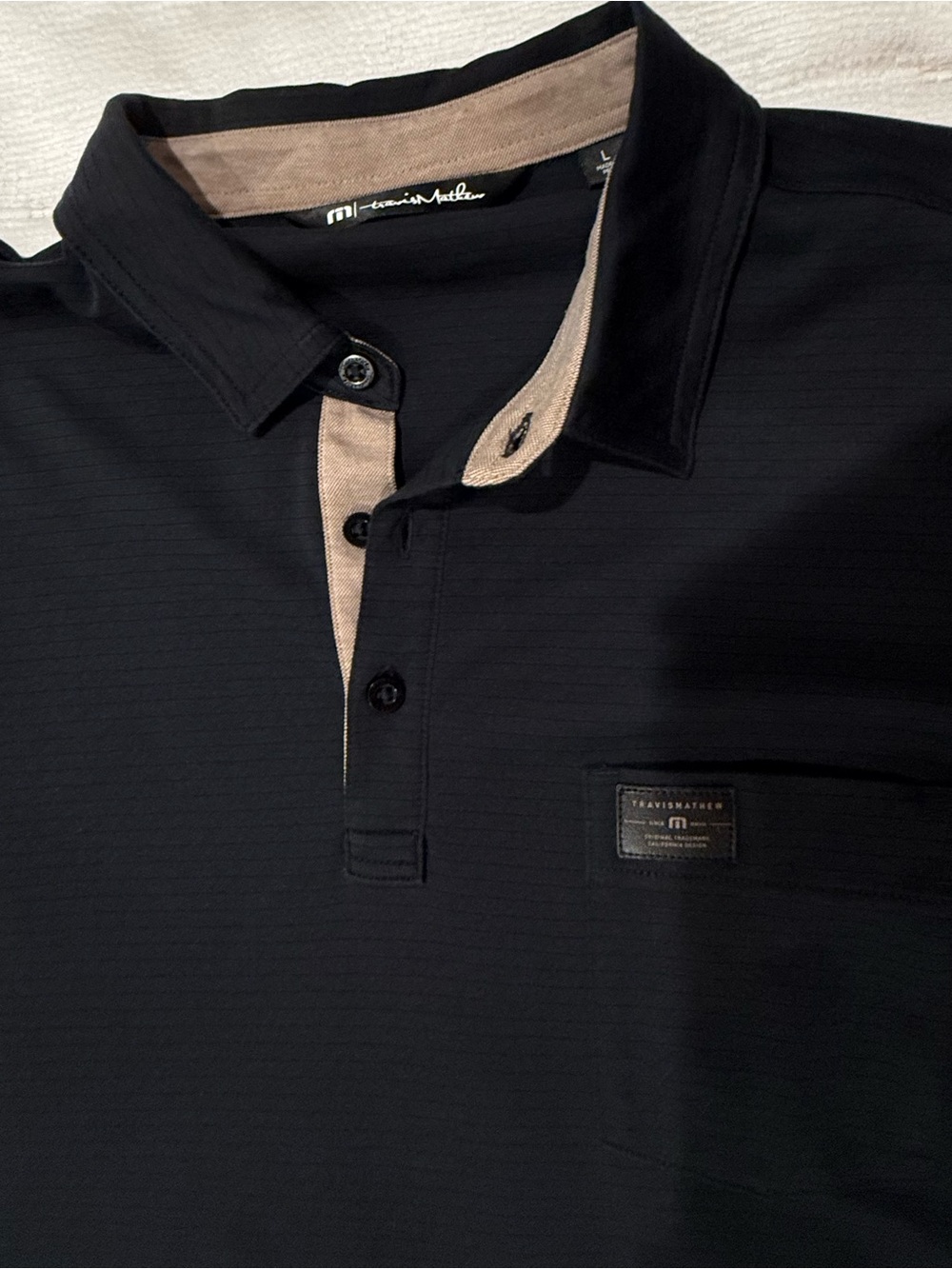 Travis Mathew Black Polo with Tan Contrast Trim